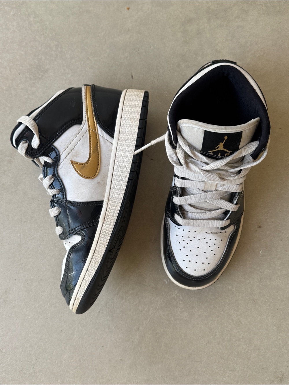 Air Jordan ones black and white Nikes gold